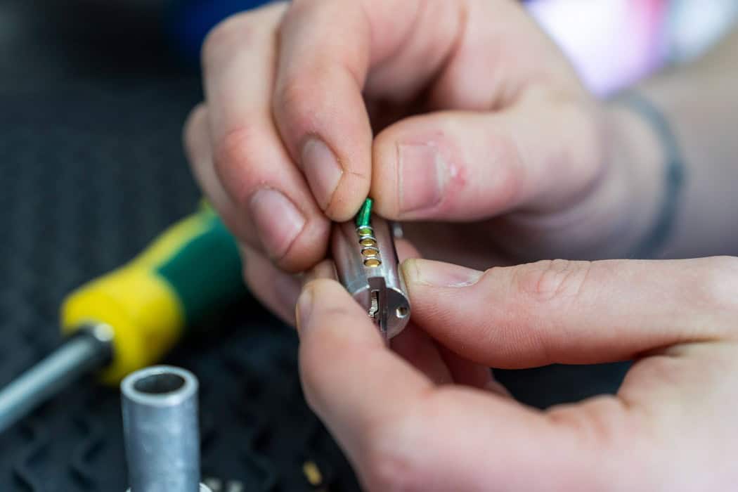 A City Locksmiths technician rekeying a lock.